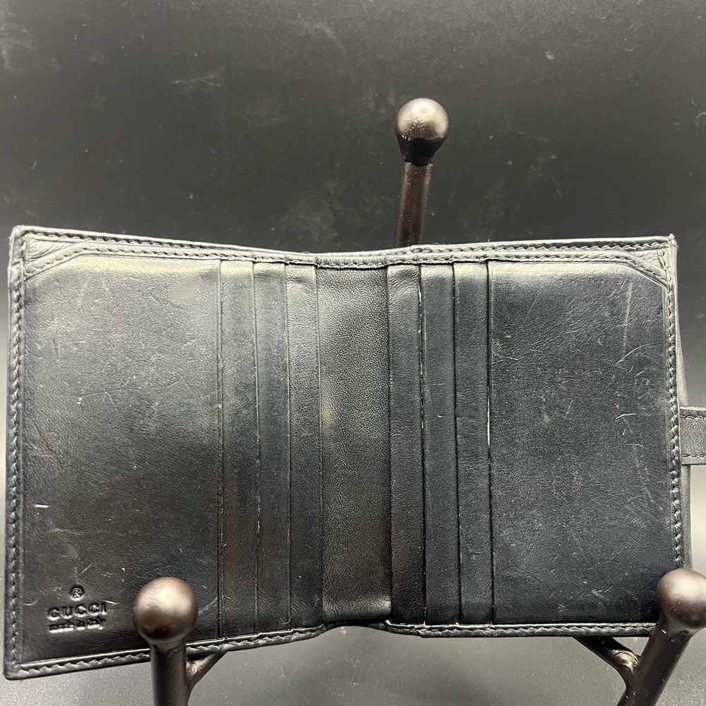 Gucci Black GG Canvas
Piston Lock Compact Wallet. - Picture 4 of 8